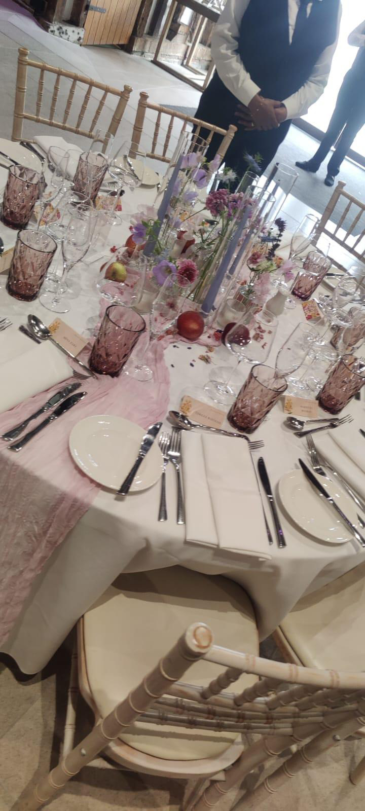 White table setting with flowers and glassware