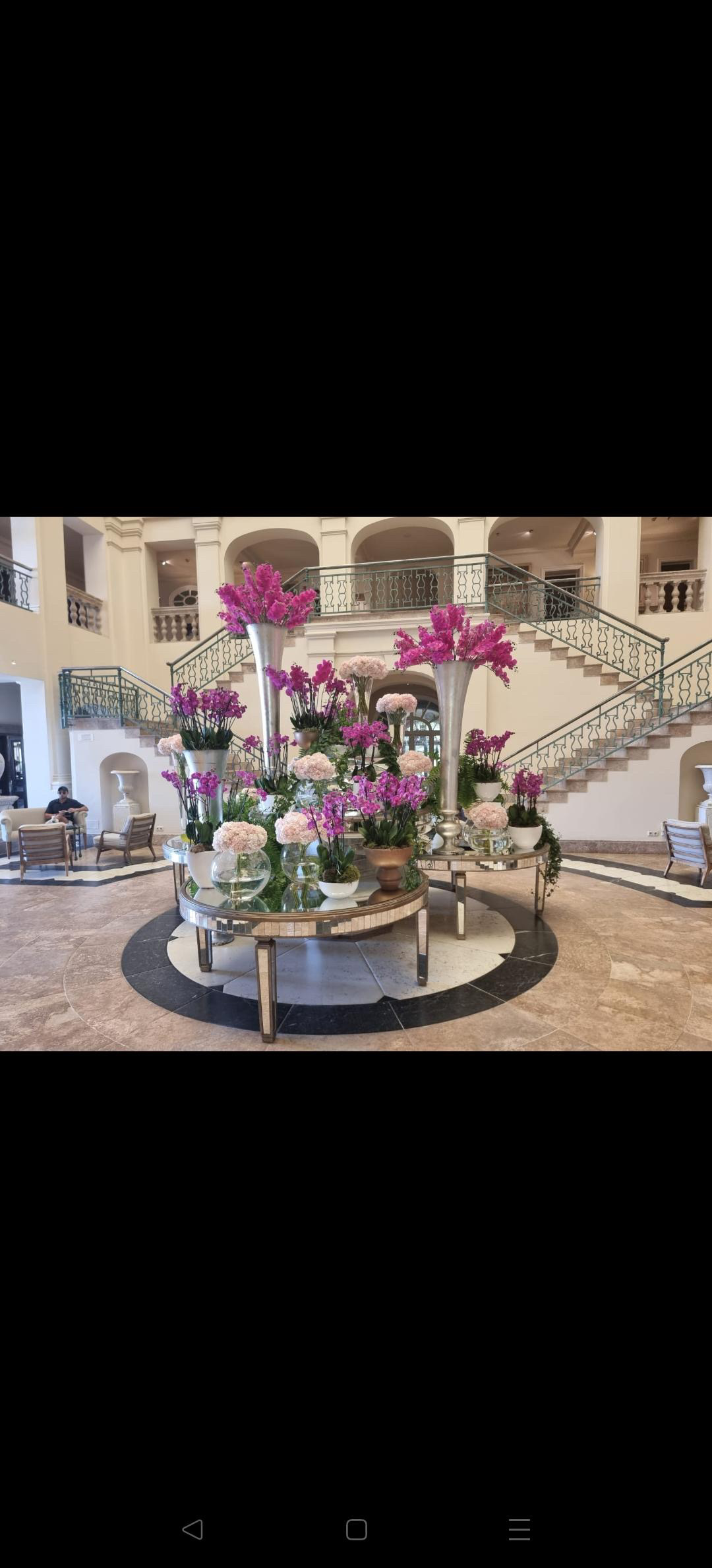 Floral centrepiece arranged for a dining table