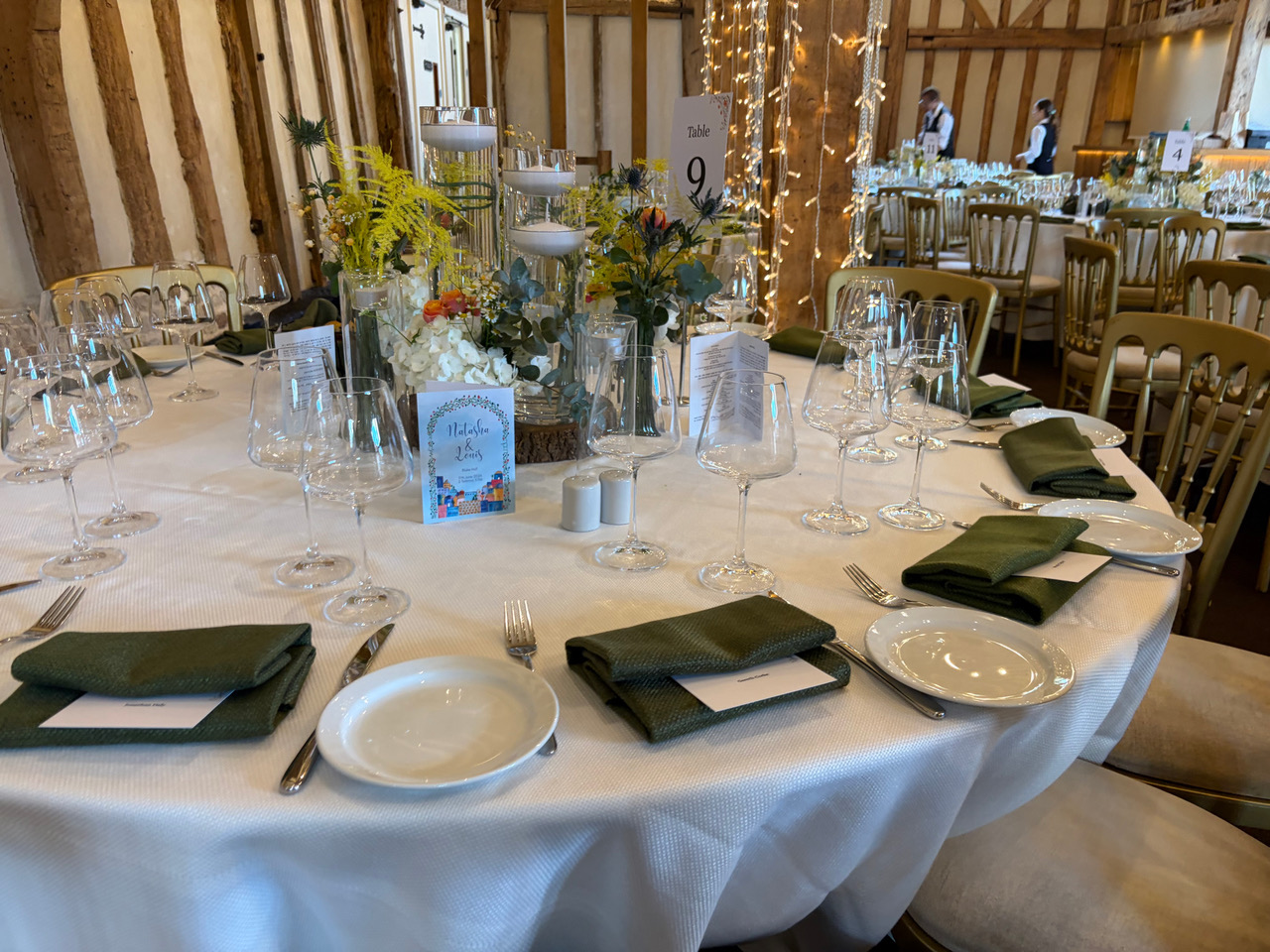 Round dining table prepared for guests